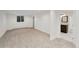 View of the finished basement featuring neutral carpet, and a bathroom with modern updates at 2111 E Alameda Ave, Denver, CO 80209