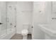 Clean bathroom featuring a shower over tub, toilet, and vanity sink at 2111 E Alameda Ave, Denver, CO 80209