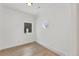 Bright bedroom with hardwood floors and a charming round window at 2111 E Alameda Ave, Denver, CO 80209