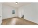 Cozy bedroom with hardwood floors and an ensuite bathroom at 2111 E Alameda Ave, Denver, CO 80209