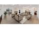 Bright living room with fireplace, hardwood floors, and an open floor plan at 2111 E Alameda Ave, Denver, CO 80209