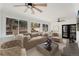 Inviting living room with plush sofa, ceiling fans, neutral tones, and backyard access at 2111 E Alameda Ave, Denver, CO 80209