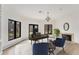 Office with fireplace, wood desk, and natural light from black trimmed windows at 2111 E Alameda Ave, Denver, CO 80209