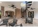 Outdoor space with spiral staircase, ceiling fans, and brick accents at 2111 E Alameda Ave, Denver, CO 80209