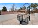 Rooftop patio with spiral staircase, brick features, and tile flooring at 2111 E Alameda Ave, Denver, CO 80209