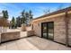 Outdoor patio with brick walls, tile floors, and a covered walkway at 2111 E Alameda Ave, Denver, CO 80209