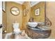 Unique powder room featuring decorative mirror and walls at 2111 E Alameda Ave, Denver, CO 80209