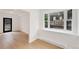 Bright space featuring a black framed door, hardwood floors, and a window looking to the outside at 2111 E Alameda Ave, Denver, CO 80209