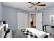 This minimalist bedroom features sleek, white, modern furnishings and plenty of natural light at 45025 Antler Cir, Elizabeth, CO 80107