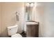 Cozy half bathroom with modern vanity and neutral wall paint creating a clean simple style at 350 N Langdale Ct, Aurora, CO 80018