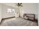 Well-lit carpeted bedroom featuring a closet and ample natural light at 350 N Langdale Ct, Aurora, CO 80018
