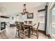 Elegant dining room featuring wood floors and a stylish light fixture at 350 N Langdale Ct, Aurora, CO 80018