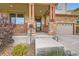 Inviting front porch with stone pillars, a concrete walkway, and a decorative metal accent at 350 N Langdale Ct, Aurora, CO 80018