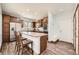 Well-equipped kitchen featuring stainless steel appliances and a breakfast bar seating two at 350 N Langdale Ct, Aurora, CO 80018