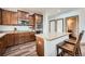 Spacious kitchen with an island, stainless steel appliances, and wooden cabinetry at 350 N Langdale Ct, Aurora, CO 80018