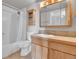 Functional bathroom featuring a tub/shower, vanity with wood cabinets, and a toilet at 1301 Speer Blvd # 1008, Denver, CO 80204