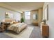 Comfortable bedroom with a large window offering city views and a neutral color scheme at 1301 Speer Blvd # 1008, Denver, CO 80204
