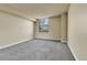 Neutral bedroom with carpet and a city view from the window at 1301 Speer Blvd # 1008, Denver, CO 80204