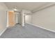 Bedroom featuring carpet, a mirrored sliding-door closet, and neutral walls at 1301 Speer Blvd # 1008, Denver, CO 80204
