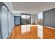 Open living room with hardwood floors, a large window, and city views at 1301 Speer Blvd # 1008, Denver, CO 80204