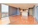 Living room featuring floor to ceiling windows, and an eat in kitchen area with pendant lighting at 1301 Speer Blvd # 1008, Denver, CO 80204