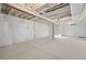 Unfinished basement with concrete floors and white insulation at 21134 E 63Rd Dr, Aurora, CO 80019