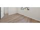 Bright bedroom with light wood flooring and a large window at 21134 E 63Rd Dr, Aurora, CO 80019