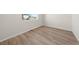 Bright bedroom with light wood flooring and a large window at 21134 E 63Rd Dr, Aurora, CO 80019
