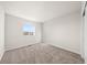 Cozy bedroom with plush carpeting and a window view to the outside at 21134 E 63Rd Dr, Aurora, CO 80019