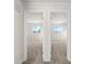 Bedrooms through open doorways, showcasing neutral color palettes at 21134 E 63Rd Dr, Aurora, CO 80019