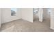 Bright bedroom with plush carpeting, natural light and ensuite bathroom entrance at 21134 E 63Rd Dr, Aurora, CO 80019