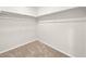 Walk in closet with carpeted floor and built in shelving for optimal storage at 21134 E 63Rd Dr, Aurora, CO 80019