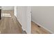 Entry hallway with durable wood flooring that transitions to other rooms at 21134 E 63Rd Dr, Aurora, CO 80019