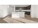 Bright kitchen with a large island, stainless steel appliances, and modern cabinetry at 21134 E 63Rd Dr, Aurora, CO 80019
