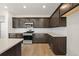 Modern kitchen featuring stainless steel appliances, sleek countertops, and ample cabinet space at 21134 E 63Rd Dr, Aurora, CO 80019