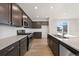 Modern kitchen featuring stainless steel appliances, sleek countertops, and ample cabinet space at 21134 E 63Rd Dr, Aurora, CO 80019