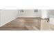 Spacious living room area with wood floors, light walls and baseboards at 21134 E 63Rd Dr, Aurora, CO 80019