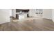 Bright, open living area with wood floors, connecting kitchen, dining and outdoor space at 21134 E 63Rd Dr, Aurora, CO 80019