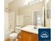Bright bathroom featuring a shower-tub combination, vanity, and white tile at 5720 S Tempe Ct, Aurora, CO 80015