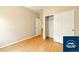 Bedroom with wood floors, closet, and access to the bathroom at 5720 S Tempe Ct, Aurora, CO 80015