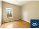 Small bedroom with wood floors and window at 5720 S Tempe Ct, Aurora, CO 80015
