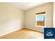 Bedroom with wood floors and window overlooking the backyard at 5720 S Tempe Ct, Aurora, CO 80015