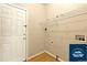 A laundry room with wire shelving and a white door to the left at 5720 S Tempe Ct, Aurora, CO 80015