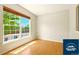 Living room featuring hardwood floors, large window, and neutral colored walls at 5720 S Tempe Ct, Aurora, CO 80015