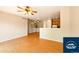 Open concept living room with wood floors and view of the kitchen at 5720 S Tempe Ct, Aurora, CO 80015