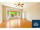 Living room with bay window and wood floors at 5720 S Tempe Ct, Aurora, CO 80015