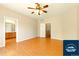 Spacious main bedroom with wood floors, ceiling fan and ensuite bathroom at 5720 S Tempe Ct, Aurora, CO 80015