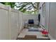 Private fenced back patio with furniture and a grill for relaxing outdoors at 9713 W Chatfield Ave # H, Littleton, CO 80128