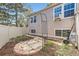 Backyard with an arbor, garden, stone and mulch landscaping at 9713 W Chatfield Ave # H, Littleton, CO 80128