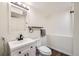 Bathroom featuring a white vanity, contemporary faucet, and modern lighting at 9713 W Chatfield Ave # H, Littleton, CO 80128